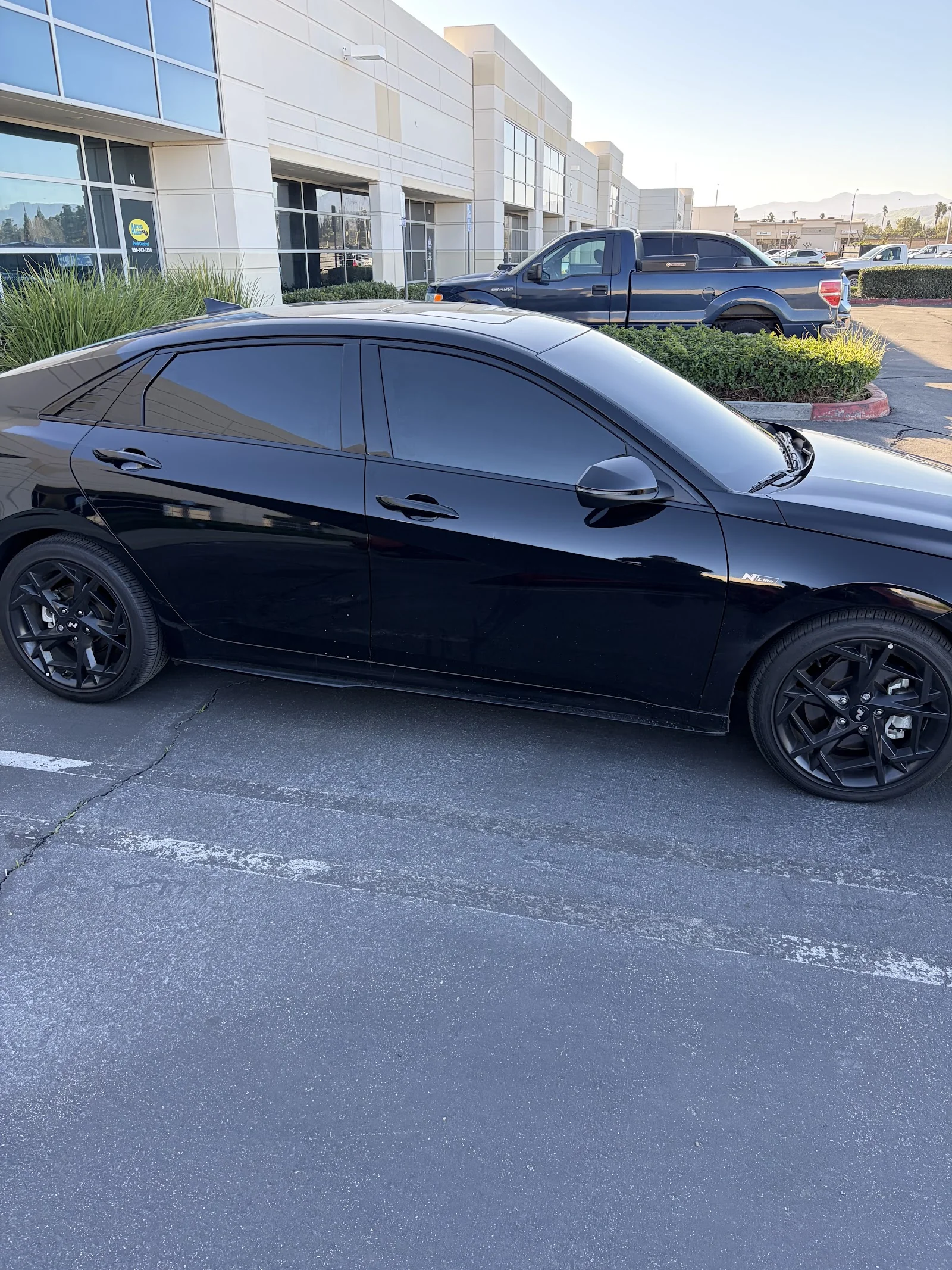 Clean side profile of a tinted black sedan — MVP Tints